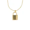 Collier Céleste & Lock grand. Pendentif doré et en acier inoxydable en forme de cadenas, de grande taille, avec sa chaîne maille Singapour dorée et en acier inoxydable.